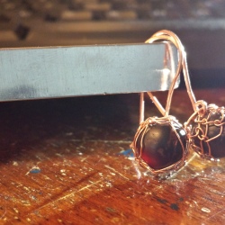 Tumbled garnet and copper net earrings with hammered components.